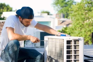 HVAC worker performing Heat Pump Maintenance in Parsippany, NJ