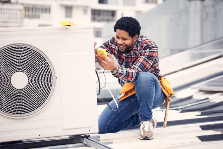 Technician performing heat pump services in East Hanover, NJ